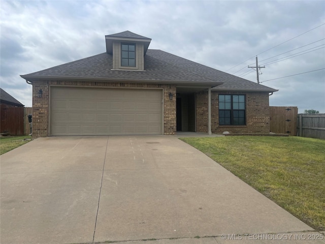 view of front of property featuring concrete driveway, fence, brick siding, a shingled roof, and a front yard