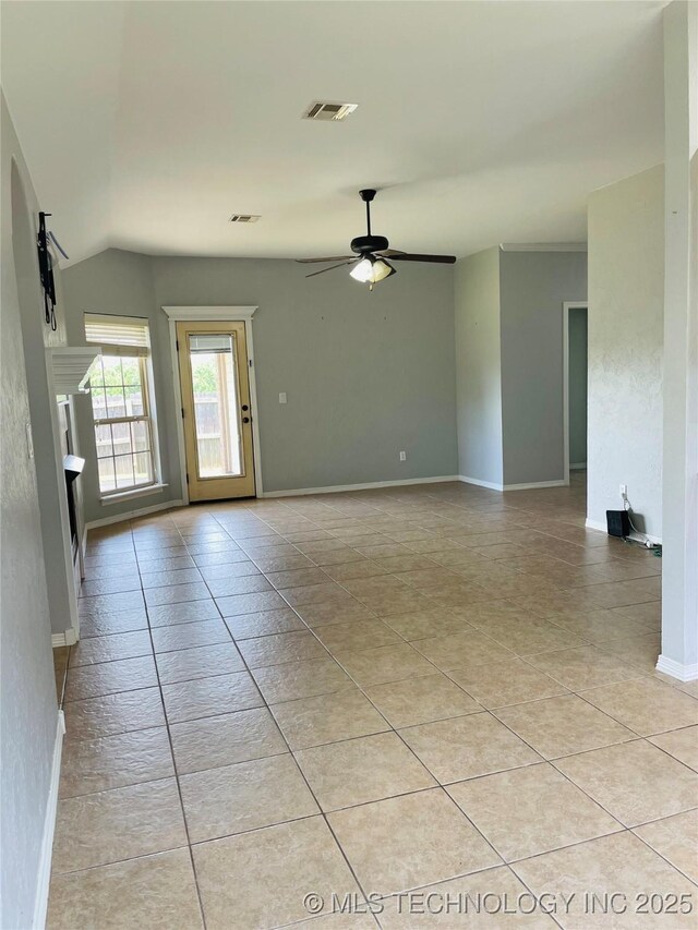 9700 E 110th St N, Owasso, OK 74055 - unfurnished room with ceiling fan, lofted ceiling, and light tile patterned floors