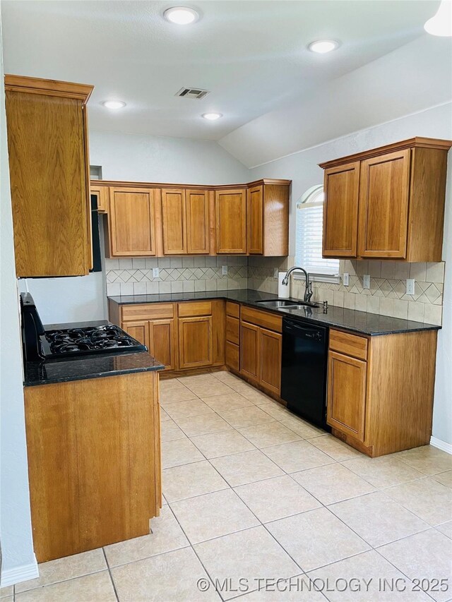 9700 E 110th St N, Owasso, OK 74055 - kitchen with black appliances, vaulted ceiling, brown cabinetry, decorative backsplash, and dark countertops