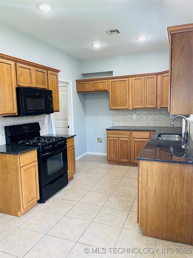 9700 E 110th St N, Owasso, OK 74055 - kitchen featuring black appliances, brown cabinets, backsplash, dark stone counters, and recessed lighting