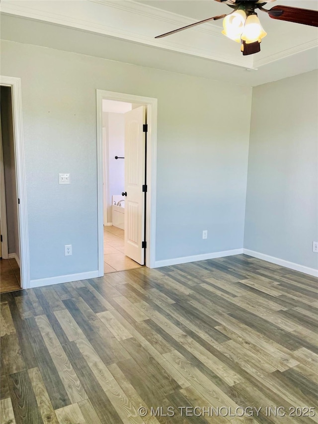 9700 E 110th St N, Owasso, OK 74055 - empty room with a ceiling fan, wood finished floors, and crown molding