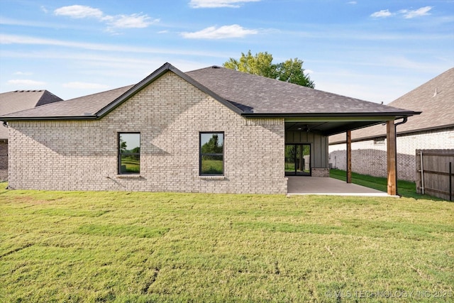 4231 W 4th St, Skiatook, OK 74070 - rear view of house with a patio area, a shingled roof, brick siding, and board and batten siding