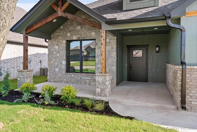 4231 W 4th St, Skiatook, OK 74070 - entrance to property featuring a shingled roof, stone siding, and a porch