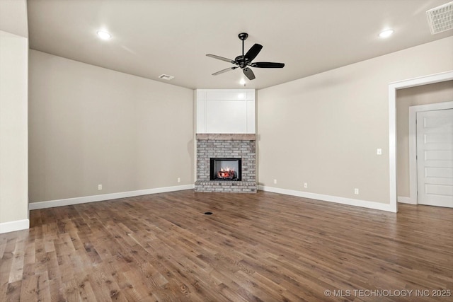 4231 W 4th St, Skiatook, OK 74070 - unfurnished living room featuring ceiling fan, wood finished floors, a brick fireplace, and recessed lighting