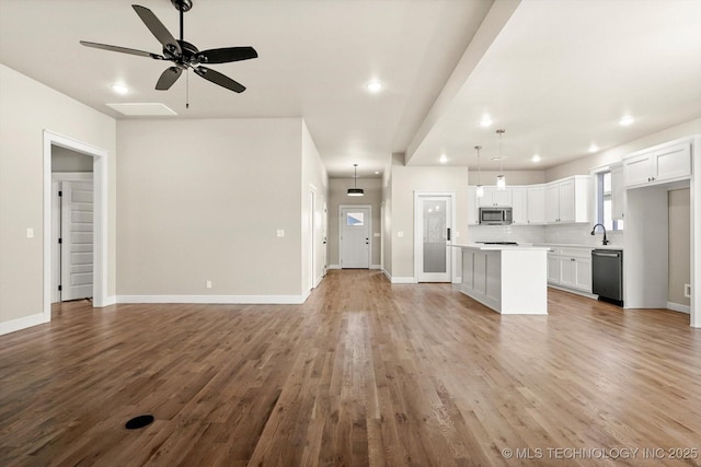 4231 W 4th St, Skiatook, OK 74070 - unfurnished living room with ceiling fan, light wood-type flooring, and recessed lighting