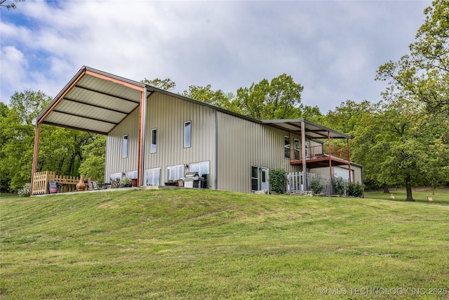 3633 Sawmill, Caddo, OK 74729 - rear view of property featuring a yard, a pole building, and a deck