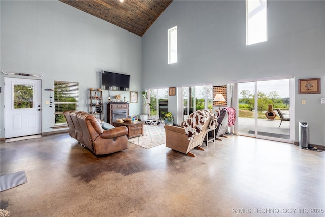 3633 Sawmill, Caddo, OK 74729 - living area with a glass covered fireplace, plenty of natural light, high vaulted ceiling, and wooden ceiling