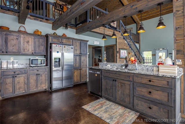 3633 Sawmill, Caddo, OK 74729 - kitchen with stainless steel appliances, a sink, concrete flooring, beamed ceiling, and pendant lighting