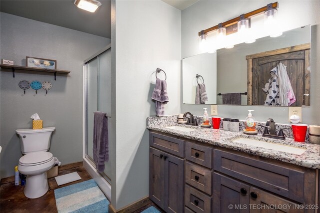 3633 Sawmill, Caddo, OK 74729 - full bathroom with double vanity, toilet, a stall shower, and a sink
