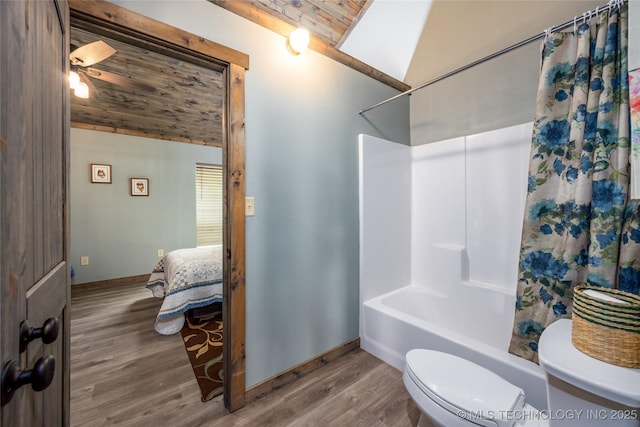 3633 Sawmill, Caddo, OK 74729 - bathroom featuring vaulted ceiling, wood finished floors, toilet, shower / bath combo with shower curtain, and baseboards