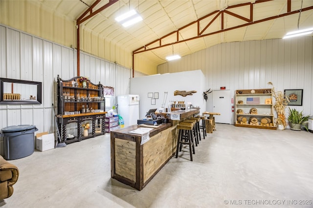 3633 Sawmill, Caddo, OK 74729 - garage with freestanding refrigerator and metal wall