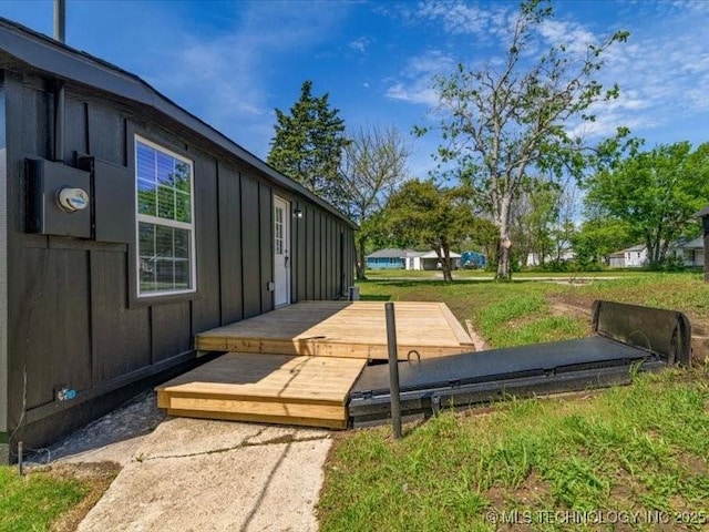 322 W Seneca St, Nowata, OK 74048 - exterior space featuring board and batten siding