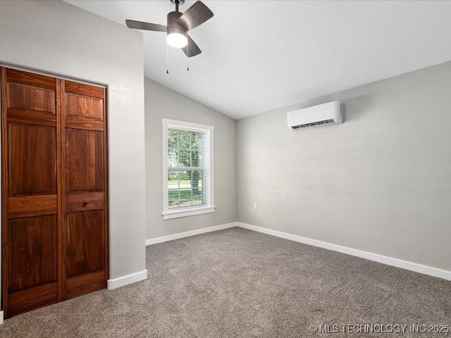 322 W Seneca St, Nowata, OK 74048 - unfurnished bedroom featuring lofted ceiling, carpet, a ceiling fan, baseboards, and a wall mounted AC
