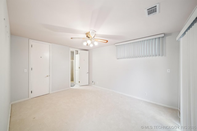 unfurnished bedroom with carpet, visible vents, ceiling fan, and baseboards