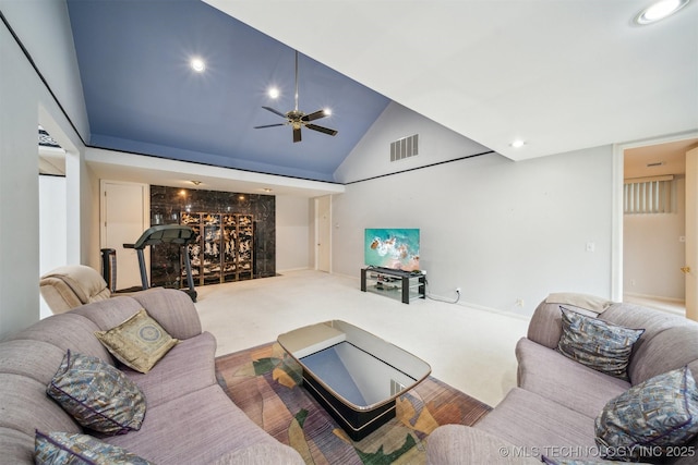 carpeted living room featuring visible vents, recessed lighting, a ceiling fan, high vaulted ceiling, and a bar