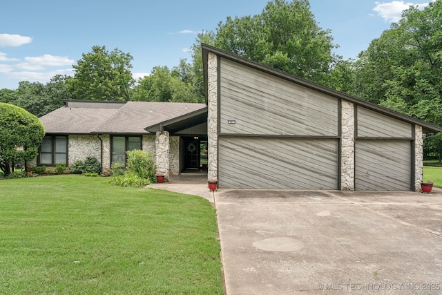 501 E Yuma Dr, Broken Arrow, OK 74011 - mid-century inspired home featuring concrete driveway, a front yard, a garage, stone siding, and roof with shingles