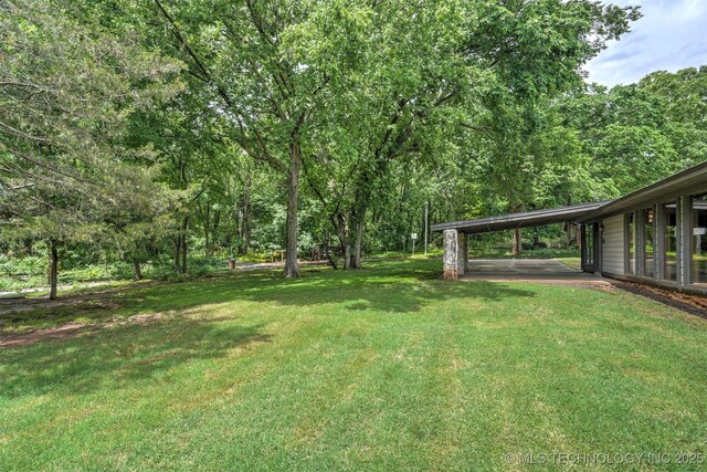 501 E Yuma Dr, Broken Arrow, OK 74011 - view of yard featuring a carport