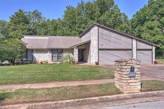 501 E Yuma Dr, Broken Arrow, OK 74011 - mid-century inspired home featuring an attached garage, a front yard, driveway, and stone siding