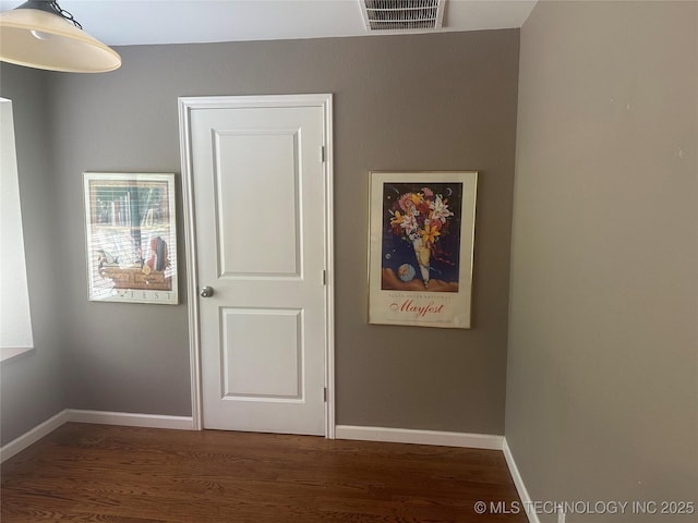 501 E Yuma Dr, Broken Arrow, OK 74011 - unfurnished bedroom featuring baseboards, visible vents, and wood finished floors