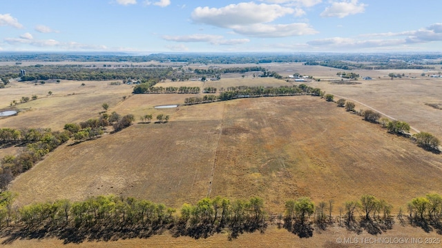 birds eye view of property featuring a rural view