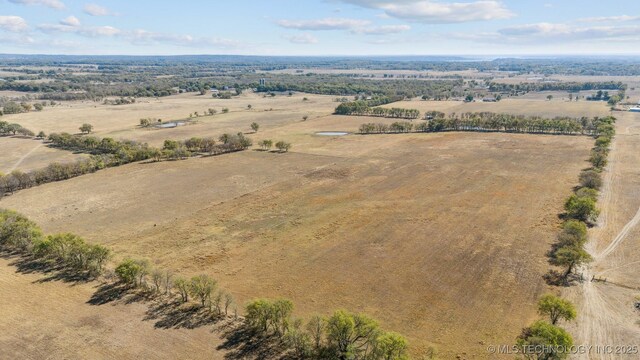 birds eye view of property with a rural view