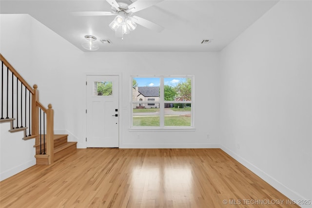 924 S Allegheny Ave, Tulsa, OK 74112 - entrance foyer with baseboards, stairs, visible vents, and light wood-type flooring