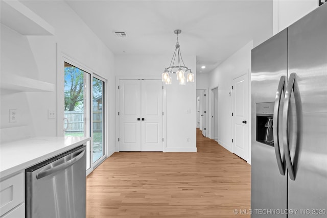 924 S Allegheny Ave, Tulsa, OK 74112 - kitchen featuring light wood-style flooring, recessed lighting, a chandelier, decorative light fixtures, and appliances with stainless steel finishes