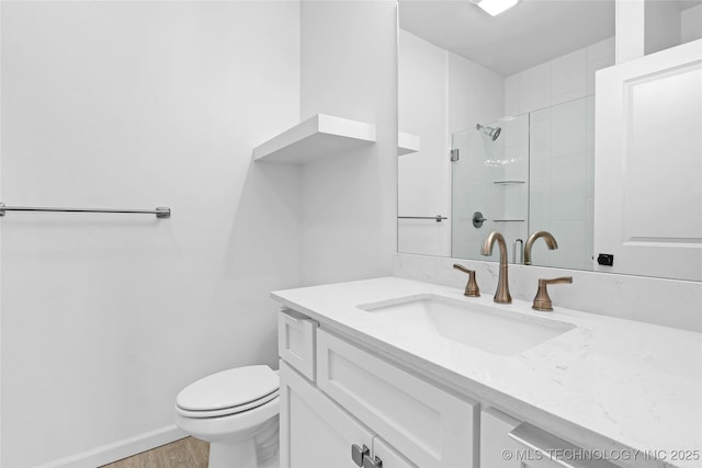 924 S Allegheny Ave, Tulsa, OK 74112 - bathroom featuring a shower stall, wood finished floors, toilet, vanity, and baseboards
