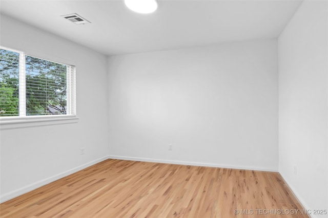 924 S Allegheny Ave, Tulsa, OK 74112 - empty room with baseboards, wood finished floors, and visible vents