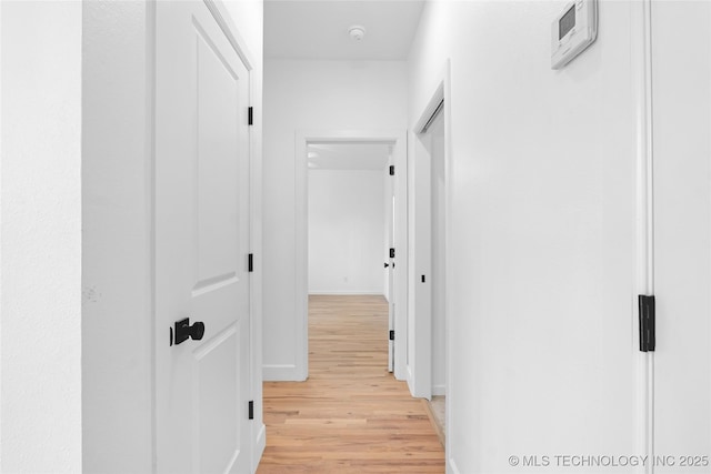 924 S Allegheny Ave, Tulsa, OK 74112 - hallway with baseboards and light wood-style floors