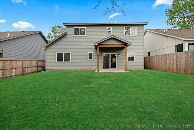 924 S Allegheny Ave, Tulsa, OK 74112 - back of property with a lawn and a fenced backyard