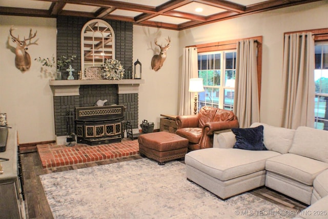 9996 N Millennium, Sulphur, OK 73086 - living area with a wood stove, wood finished floors, coffered ceiling, and beamed ceiling