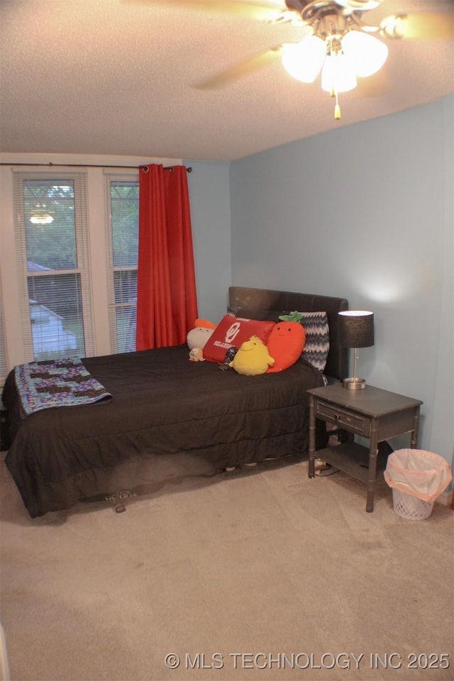 9996 N Millennium, Sulphur, OK 73086 - bedroom featuring a ceiling fan, a textured ceiling, and carpet flooring