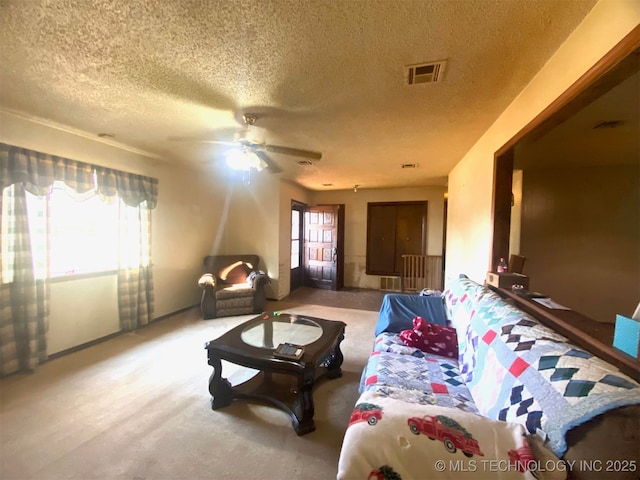 1320 Jennings St, Muskogee, OK 74403 - living area with a textured ceiling, carpet flooring, and a ceiling fan