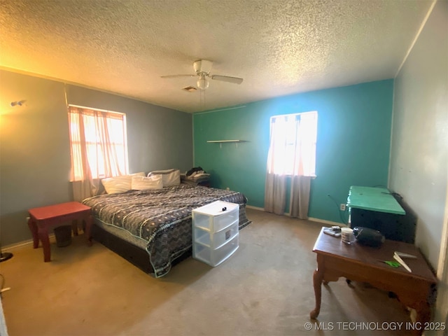 1320 Jennings St, Muskogee, OK 74403 - carpeted bedroom with a textured ceiling, a ceiling fan, and baseboards