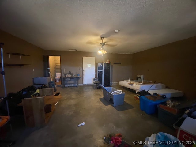 1320 Jennings St, Muskogee, OK 74403 - living room with unfinished concrete floors and a ceiling fan