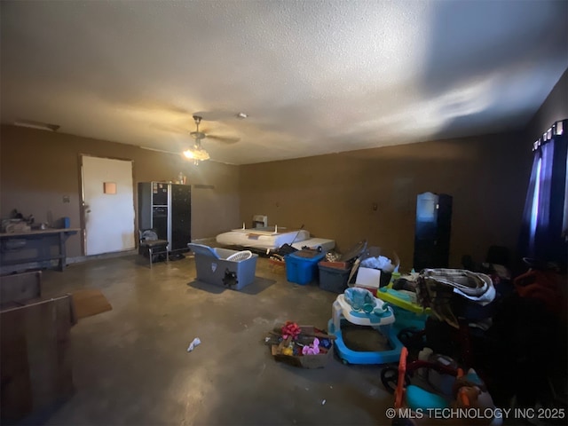 1320 Jennings St, Muskogee, OK 74403 - unfurnished living room featuring unfinished concrete floors and ceiling fan