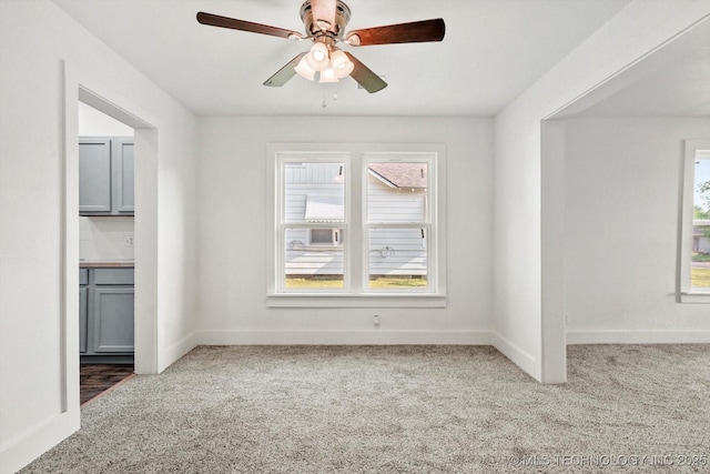 722 S Hughes Ave, Morris, OK 74445 - unfurnished living room with carpet flooring, baseboards, and a ceiling fan
