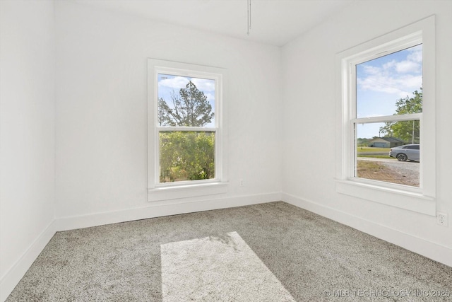 722 S Hughes Ave, Morris, OK 74445 - carpeted spare room featuring baseboards and plenty of natural light