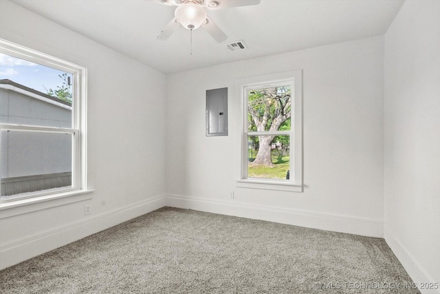 722 S Hughes Ave, Morris, OK 74445 - carpeted empty room featuring plenty of natural light, electric panel, baseboards, and visible vents