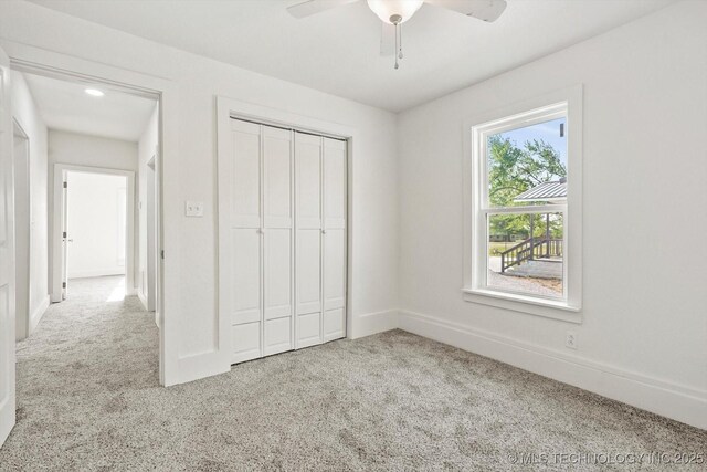 722 S Hughes Ave, Morris, OK 74445 - unfurnished bedroom featuring a ceiling fan, baseboards, carpet floors, and a closet