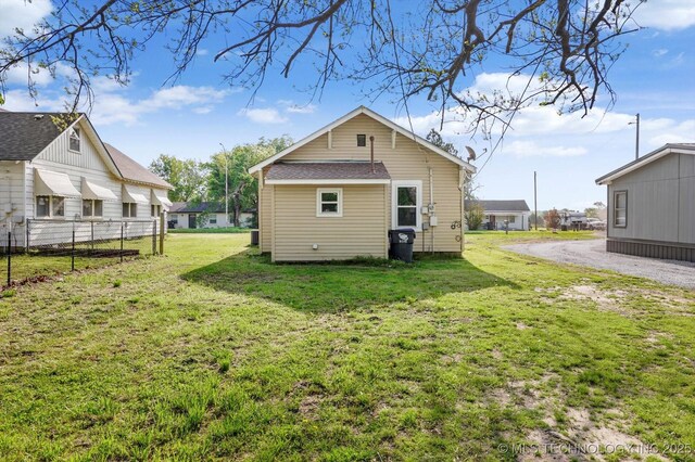 722 S Hughes Ave, Morris, OK 74445 - rear view of property with a lawn