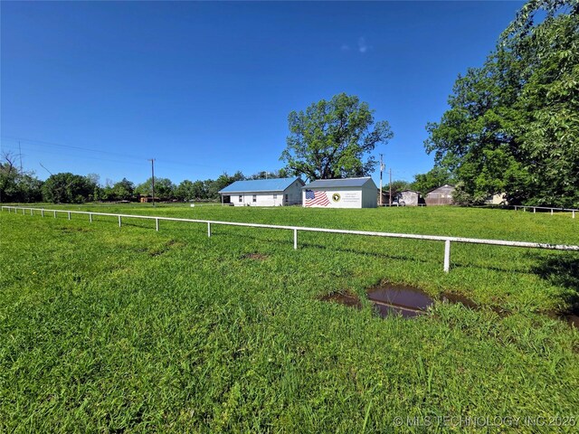 602 N Collins Ave, Okmulgee, OK 74447 - view of yard featuring a rural view and fence