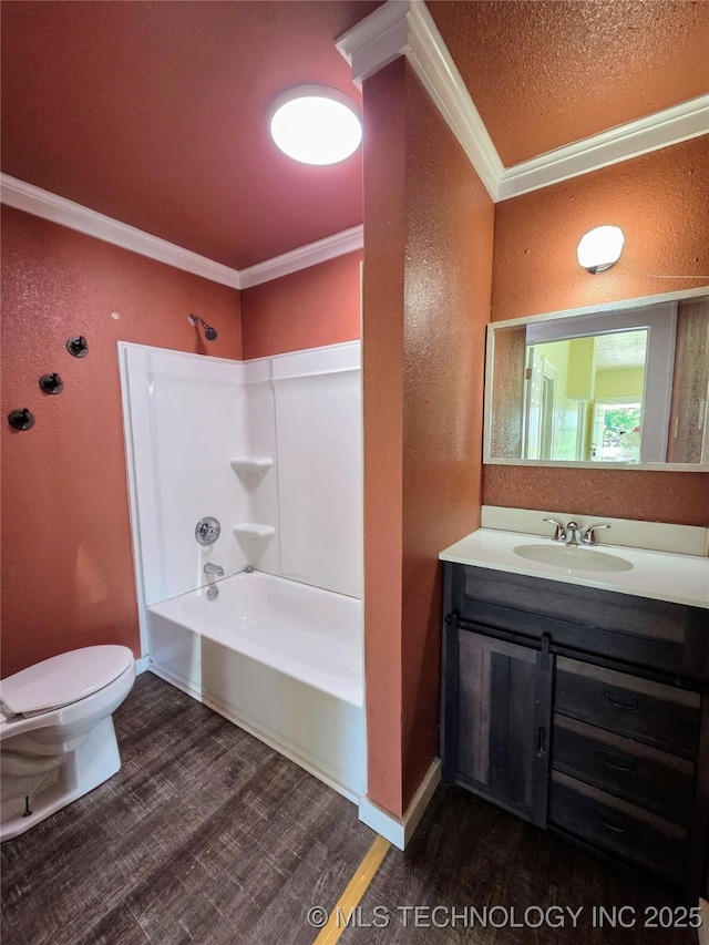 602 N Collins Ave, Okmulgee, OK 74447 - bathroom featuring ornamental molding, a textured wall, toilet, and wood finished floors