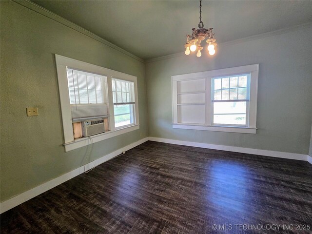 602 N Collins Ave, Okmulgee, OK 74447 - unfurnished dining area with an inviting chandelier, ornamental molding, and dark wood-style floors