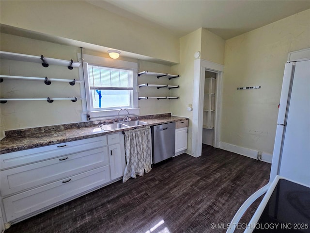 602 N Collins Ave, Okmulgee, OK 74447 - kitchen with open shelves, stove, dishwasher, a sink, and freestanding refrigerator