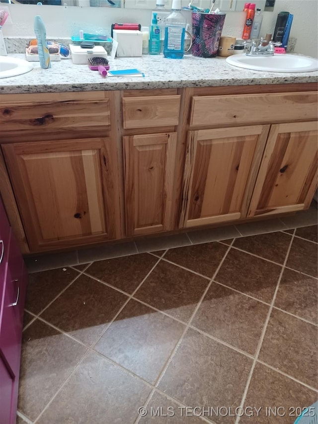 bathroom featuring tile patterned floors and vanity