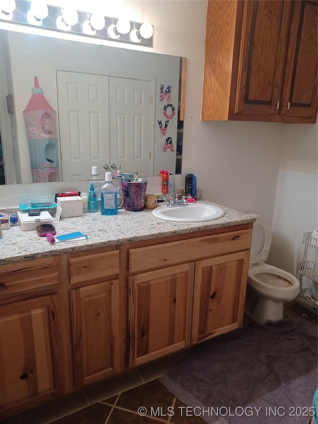 bathroom with vanity and toilet