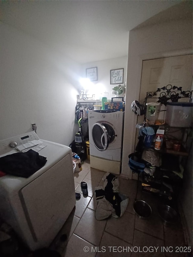 laundry room with tile patterned floors and laundry area