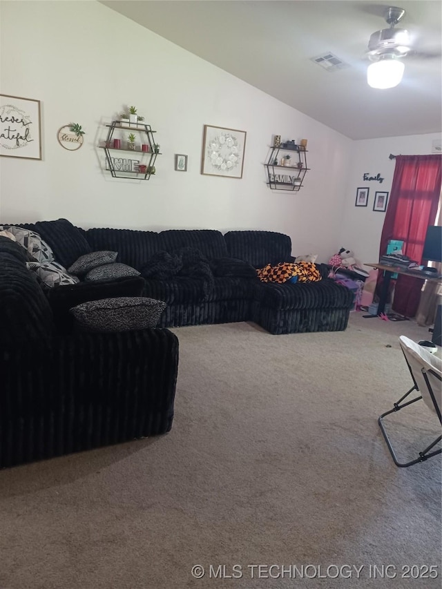 carpeted living area with lofted ceiling, visible vents, and ceiling fan